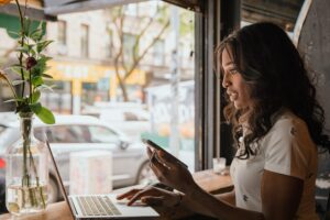 Woman working in cafe.