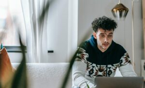 Frustrated man staring at laptop screen